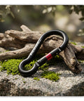 Heavy Duty Carabiner Clip With Spring Snap Wire Gate 3 Inch Aluminum Karabiner resting on mossy rock and wood