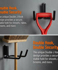 Two Pack E Track Heavy Duty Double J Tool Hook Holder 13mm Diameter Powder Coated Steel For Long Handled Tools Fits E Track And X Track Rails For Trailer Truck And Garage Storage shown mounted on wall holding shovel and broom.