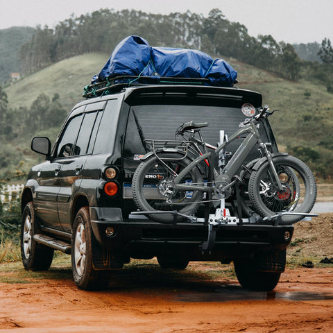Dope 2-Bike Hitch Rack For Car With Quick Release Handle on SUV carrying two bikes, showing wobble-free design and tilting feature.