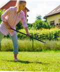 Woman using Manure Fork Hand Tool For Lawn And Farm Work With Five Point Design Five Point Tines For Clearing Manure And Grass