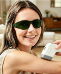 Heavy Duty Laser Safety Glasses Beast Mode OD4 Eye Protection Blocking 180NM To 660NM UV And Green Lasers With Anti Fog Scratch Proof Lenses worn by a smiling woman during a laser treatment.