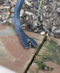 36 Inch Pry Bar With Drop Forged Steel Build, Rust Resistant Crowbar For Demolition, shown pulling a nail from wooden decking