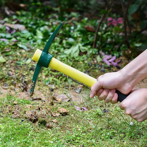 Using Drop Forged 15 Inch One Piece Adze Pick Garden Tool For Weeding And Digging, 1.4Lb Pick Axe in a garden setting.