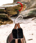 HeroClip Carabiner Gear Clip And Hook Medium For Camping Hiking And Garage Organization Versatile 3in1 Clip That Hangs Anything Secure Grip Up To 60 Lbs Rubber Tip For Stable Hold Blue Steel 2 Pack used to hang boots on a tree branch.