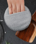 Heavy Duty Five Inch Microfiber Wood Conditioner Applicator Pads For Cutting Board Wax And Oil Spreaders On Point Kitchen Essentials No Sweat Daily Cook Gear Four Pack with gray microfiber pad and wooden spoon.