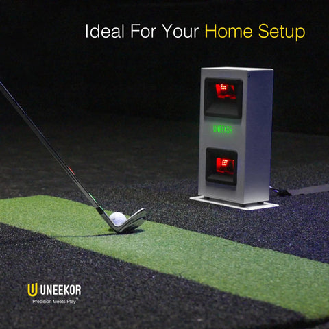 Golfer using Eye Mini Core Golf Launch Monitor And Simulator With Real Time Tracking And Near Zero Latency next to golf club.