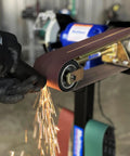 Real Badass 1HP Belt Grinder With Quick Swap 4By48 Inch Belt Auto Tension Rig And 4970 Sfpm Power grinding metal, sparks flying.