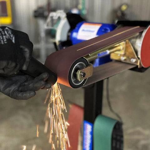 Real Badass 1HP Belt Grinder With Quick Swap 4By48 Inch Belt Auto Tension Rig And 4970 Sfpm Power grinding metal, sparks flying.