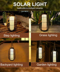 Big Solar Powered Lantern for Outdoor Use placed on a wooden table surrounded by plants for tabletop decor lighting.