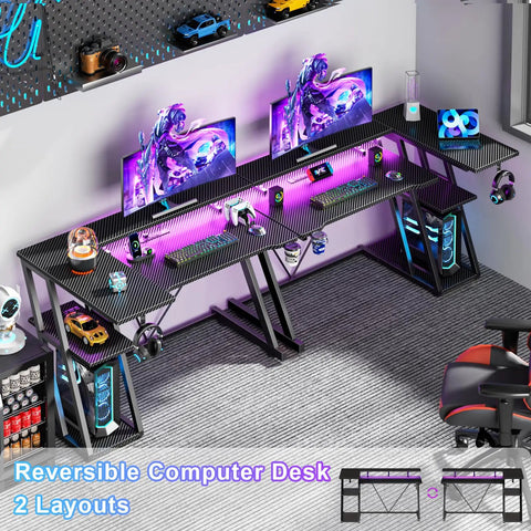 40 Inch L Shaped Gaming Desk With Power Outlet And LED Lights Carbon Fiber Textured Corner Computer Desk With 3 Tier Storage Shelves And Monitor Stand For Small Spaces in a home setup with dual monitors, RGB LED lighting, and gaming accessories.