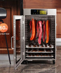 Heavy Duty Commercial Food Dehydrator With Eighteen Stackable Trays, A Hardcore Two Thousand Watt Heater, And All Stainless Steel Build with meat and jerky inside