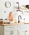 Kitchen setup featuring Oil Rubbed Bronze Cabinet Pull Monument Collection 5-1/16 Inch Center-To-Center on white cabinets