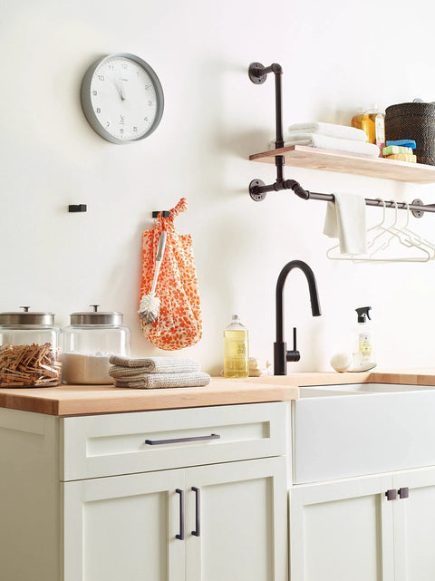 Kitchen setup featuring Oil Rubbed Bronze Cabinet Pull Monument Collection 5-1/16 Inch Center-To-Center on white cabinets