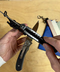 Person adjusting knife angle on Four Grit Diamond Sharpening Kit With Whetstone Aligner Quick Edge 7 Position Adjustable Diamond Stones.
