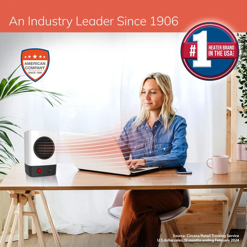 Your Own Mini Personal Ceramic Space Heater For Home And Office, 400W Quick Heat, Energy Efficient on a desk warming a user