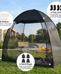Pop Up Screen Tent 6x6 Feet Black Mesh Gazebo With Peaked Roof set up in garden with sandbags and stakes