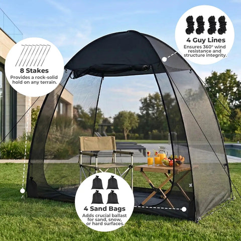 Pop Up Screen Tent 6x6 Feet Black Mesh Gazebo With Peaked Roof set up in garden with sandbags and stakes