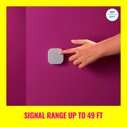 Hand pressing Portable Smart Button Wireless Light Switch With App Control Battery Powered 50 Foot Range One Tap To Turn Lights On, Off, And Dim Includes 2 AAA Batteries Perfect For Home Automation on a pink wall