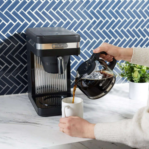 Speed Brew Elite 10 Cup Coffee Maker With Internal Stainless Steel 70 Oz Hot Water Tank Quick Brew Technology shown in use on counter