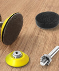 All In One 2 Inch Sanding Disc Kit with 120 pcs wet dry sandpaper, backing pad, foam buffer, and rotary tool attachment on wood surface.
