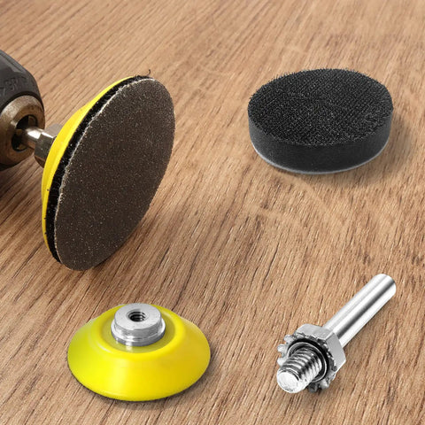 All In One 2 Inch Sanding Disc Kit with 120 pcs wet dry sandpaper, backing pad, foam buffer, and rotary tool attachment on wood surface.