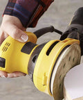 Yellow sander using 110 Piece 5 Inch 8 Hole Sanding Disc Set With Aluminum Oxide Grits 60 Through 1000 For Wood Plastic Rust Removal