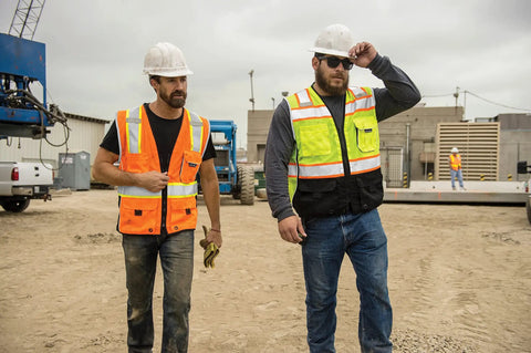Two men wearing Mens High Visibility Reflective Safety Vest Premium Black Bottom Zipper Ansi Class 2 Construction Utility Workwear Lime Green Large on a worksite.