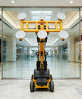 Professional Grade Heavy Duty Glass Vacuum Lifter Featuring Adjustable Suction Cups For Smooth Panel Hoisting And No Sweat Setup On Any Bustling Construction Job Site viewed from the back in a mall.