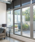 Adjustable Sliding Door Security Bar 17 To 50 Inches With Rubber Tips, visible in interior with sliding glass doors to patio, black.