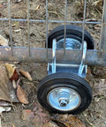 Heavy Duty Sliding Gate Wheels With Dual 6 Inch Rubber Wheels On A Sturdy Steel Carrier U Bolt Clamp Mount Fits 2 Inch Metal Tube Track Rollers For Driveway Gates Up To 800 Lbs That Prevent Sagging And Drag attached to a metal gate.