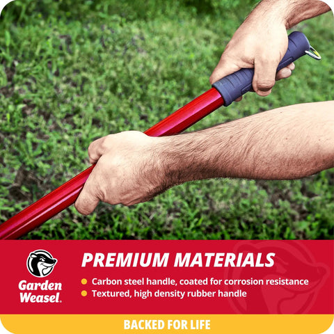 Person gripping the textured rubber handle of a carbon steel tool on grass for efficient yard clean-up with comfort.