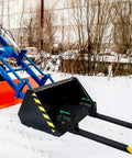 43 Inch Pallet Forks Clamp On for Tractor Bucket 1500 Lb Capacity Heavy Beefy Front Loader Attachment on snow-covered ground