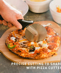 Pizza Oven Starter Bundle With Stainless Steel Outdoor Pizza Maker And Wood Fired Assembly pizza cutter slicing pizza