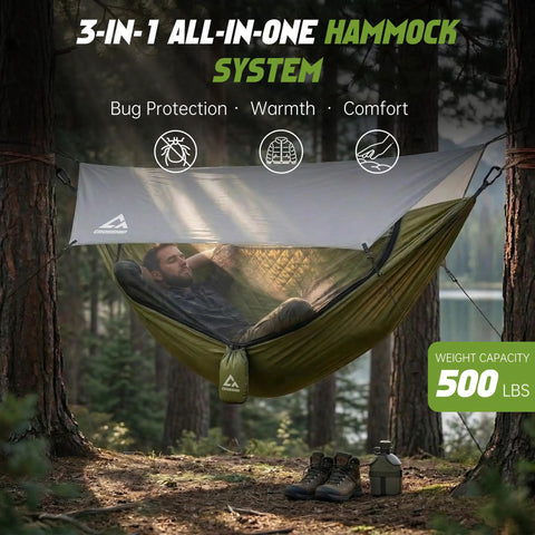 Man relaxing in 2 Person Camping Hammock With Mosquito Net And Built In Underquilt, Rain Fly Tarp in forest setting