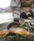 Person wearing ANSI A6 Cut Resistant Work Gloves With Three Quarters Nitrile Coating Built Tough For Woodworking Metal Cutting Glass Handling And Construction Touchscreen Ready Size Large One Pair holding a fish with a fishing rod in a river
