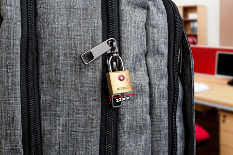 TSA Approved Luggage Padlocks 22mm Solid Brass Locks With Chrome Plated Hardened Steel Shackle on a grey suitcase zipper