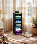 Kids Five Shelf Hanging Closet Organizer With Weekday Dividers in black, displayed in a bright room with sorted clothes for easy access.