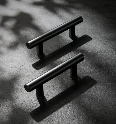 Snag This Set Of Sharp Matte Black Cabinet Handles 30 Pack Heavy Duty Stainless Steel Bar Pulls For Kitchen Drawers And Bathroom Vanity Doors Featuring 5 Inch Span And 3 Inch Hole Spacing Pro Level Upgrade - Close-up of two matte black stainless steel cabinet handles.