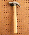 Hammer on steel pegboard, part of 16 Piece Pliers And Drivers Pegboard Hook Set With Heavy Duty Hooks And Screwdriver Rings