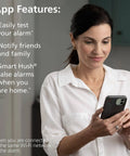 Woman using phone app for 2 In 1 Smoke Detector And Indoor Air Quality Monitor With WiFi And Alexa Compatibility Hardwired With Battery Backup Voice And App Alerts For Smoke Hazards And TVOC Levels At Home.