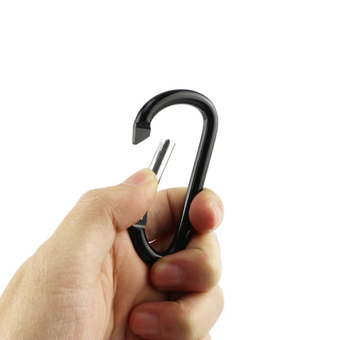 Hand holding black Aluminum Carabiner Clip Snap Hook Keychain Set Black With Multiple Sizes 1.5 1.9 2.2 2.4 2.8 Inch Carabiners For Keys Backpacks Lanyards And Light Gear Durable Go To Everyday Carry.