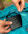 Trail Ready Ultra Compact Emergency Camping Stove for Backpacking being packed in a blue bag