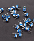 Fifteen Value 100 Ohm To 2M Ohm Variable Resistor Potentiometer Kit scattered on surface, blue and white, DIY electronics gear