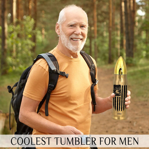 Man holding 17oz Gold Stainless Steel Tumbler With American Flag Tool Design And I Fix Stuff And I Know Things Phrase in forest