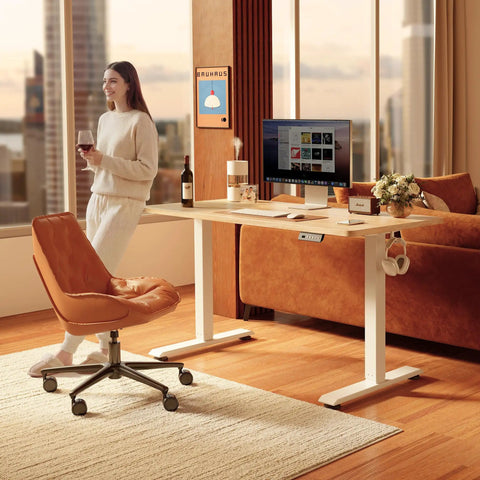 Electric Height Adjustable Standing Desk 48 Inch By 24 Inch With One Touch Lift And Three Memory Presets White Frame And Maple Top in home office