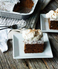 Brownie slices on plates next to 35 Pack 8x8 Inch Square Baking Pans With Snap-On Plastic Dome Lids, Heavy Duty Disposable Aluminum Foil Tins.