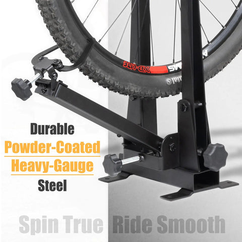 Bicycle Wheel Truing Stand For Precise Rim Alignment With Beefy Heavy Duty Base, supporting mounted bike tire.