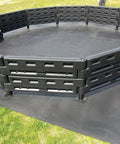 26 Foot Commercial Grade Recycled Rubber Interlocking Flooring Kit For Gaga Ball Pits For Schools Churches And Municipalities Easy Install Durable Mat System installed in black pit on grass