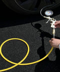 Heavy Duty 3/8 Inch By 100 Ft Hybrid Air Hose Delivering 300 Psi With Kink Resistant Build and a tire gauge attached.