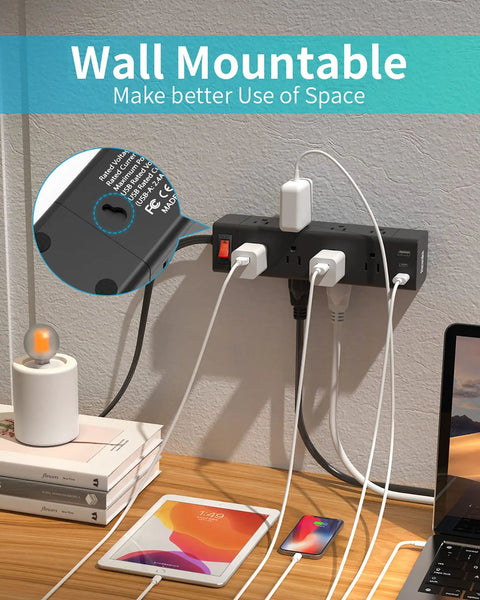 Flat 5 Ft Power Strip With USB C And 3 USB Ports 12 Outlets Surge Protector mounted on wall, charging devices.